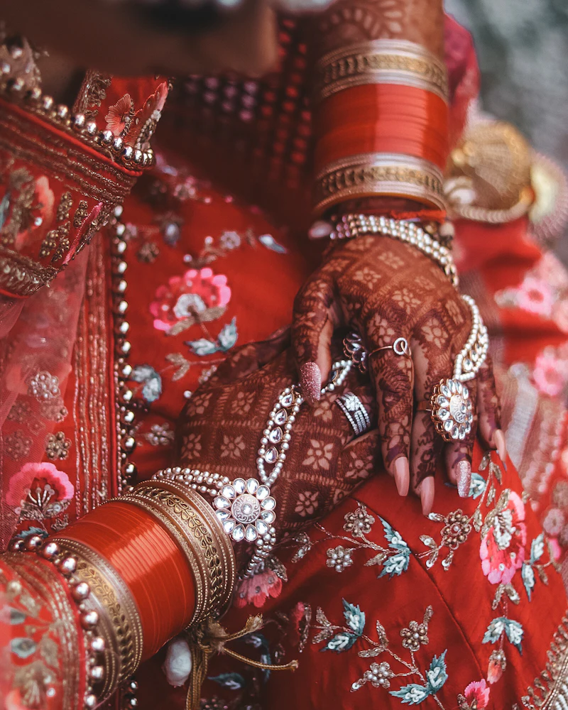 Bride-to-be's hands with engagement ring and light mehendi, Finenticee client