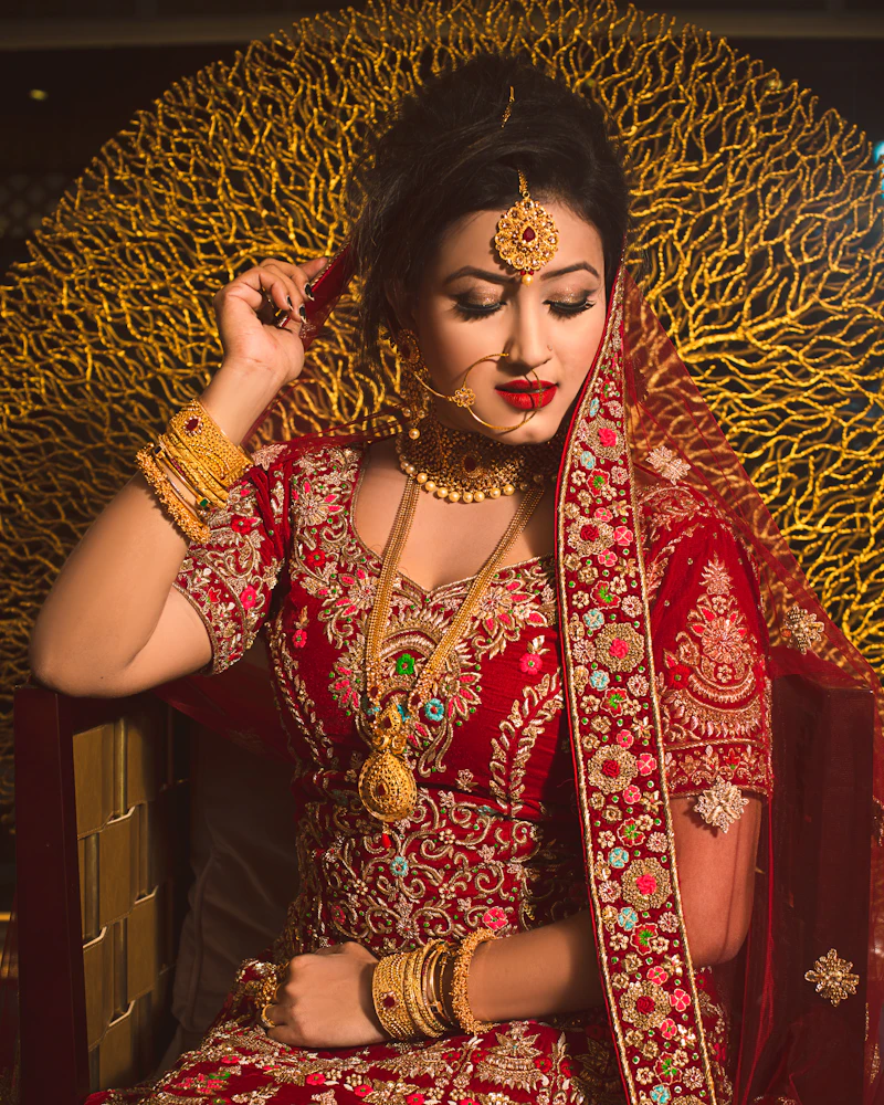 Odia bride in red and gold silk with traditional jewellery, Finenticee bridal makeup, Bhubaneswar