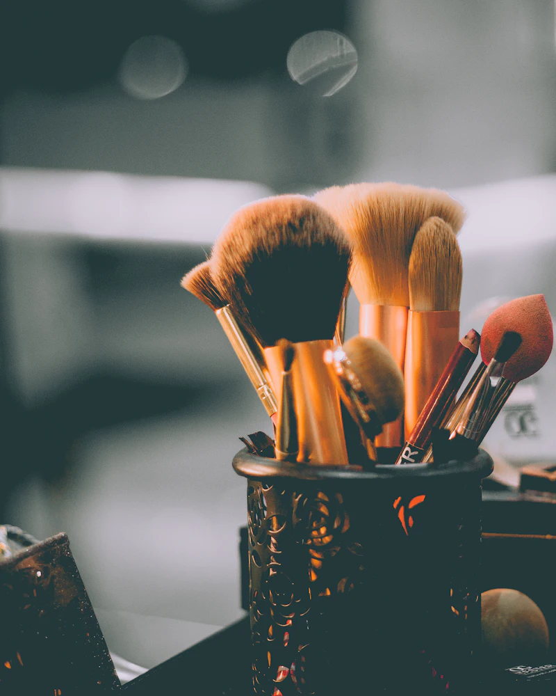 Student doing eye makeup on a model in a Finenticee makeup class, Bhubaneswar